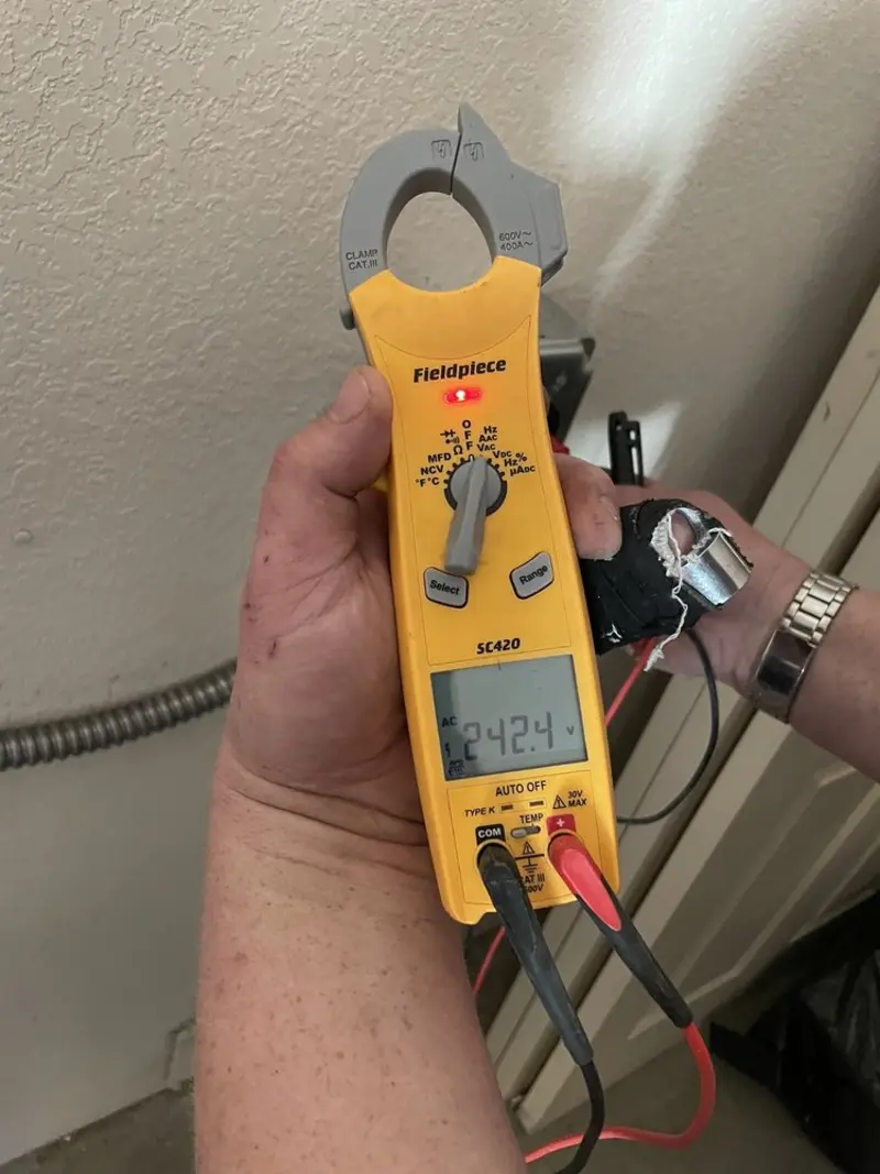 Voltage testing with clamp meter during Ceiling Fan Installation in Kings Mountain